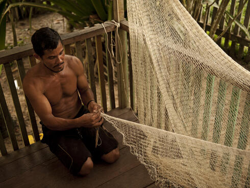 man making fishing net Amazon