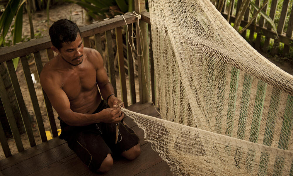 man making fishing net Amazon