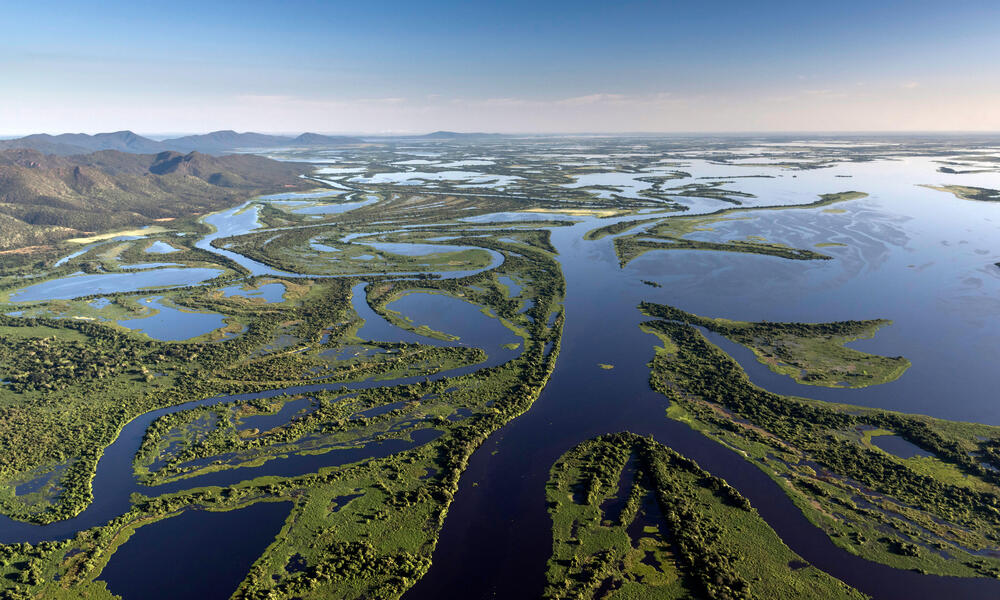 Aerial view of the Pantanal Matogrossense National Park with Amolar Mountain Ridge in the background. on a sunny day