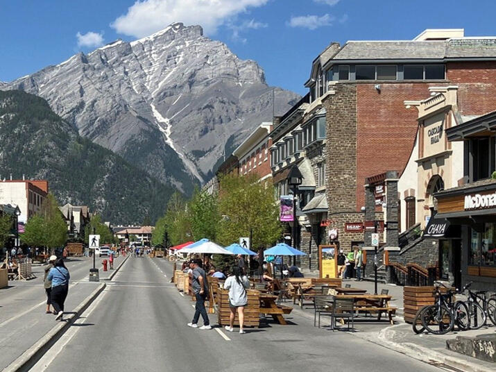 A streetscape with mountains in the background