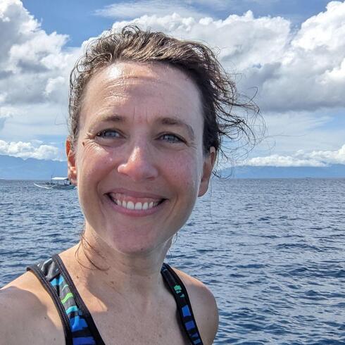 Headshot of WWF scientist Becky Chaplin-Kramer on the water in the Philippines