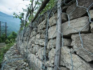 A stone wall reinforced by wire