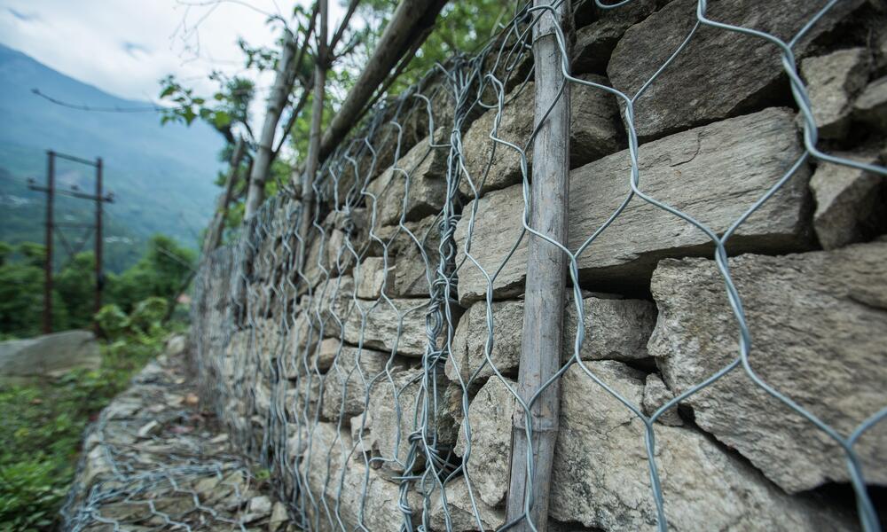A stone wall reinforced by wire