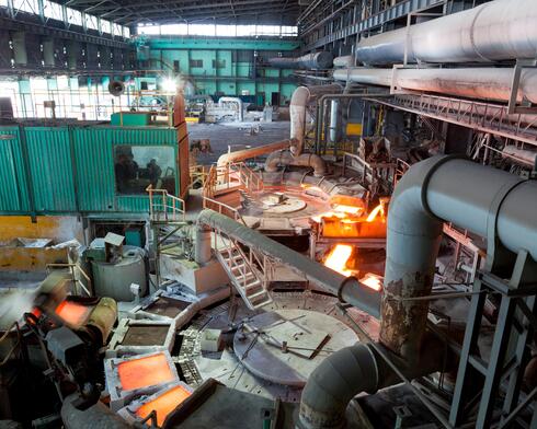 Machinery inside a blast furnace with very hot materials