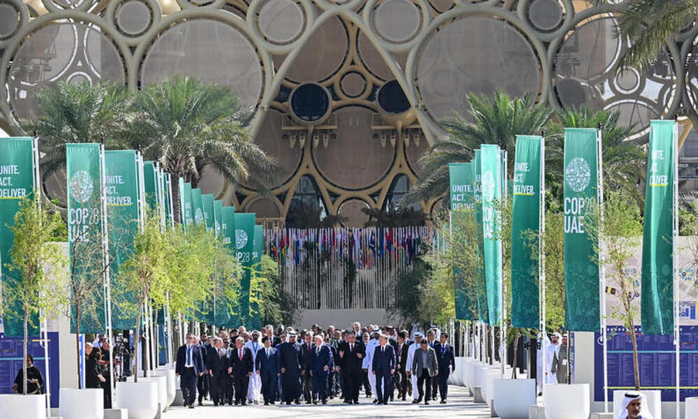 Leaders walk out of the COP28 pavilion in Dubai