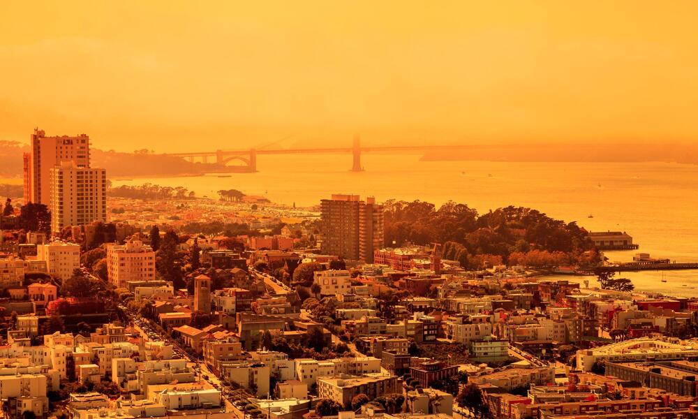 Buildings surrounded in an orange glow. 