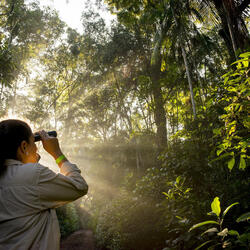 Woman looking through binoculars