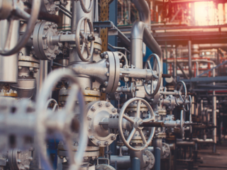 Close up of pipes and valves in a factory