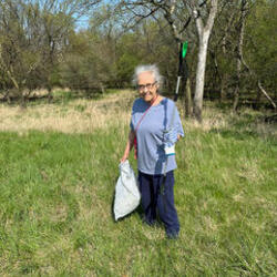 Rick and Janice cleaned up plastic and other trash around trees in preparation for Arbor Day. 