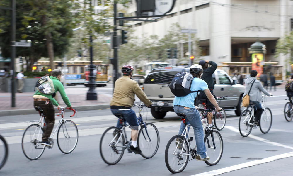 Cyclists in traffic in San Francisco, California