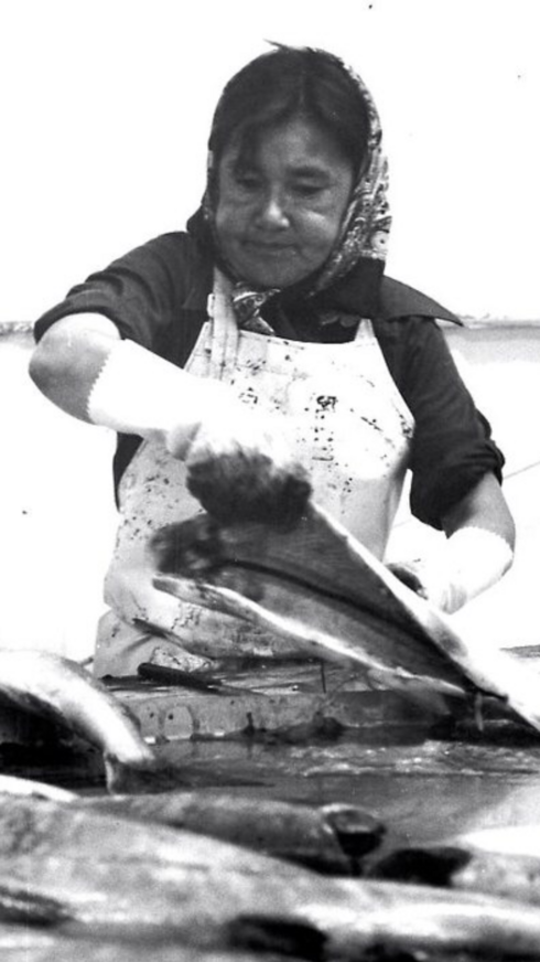 Allie Ivanoff's grandmother, Elizabeth “Abuzanuq” Ivanoff, fillets a fish