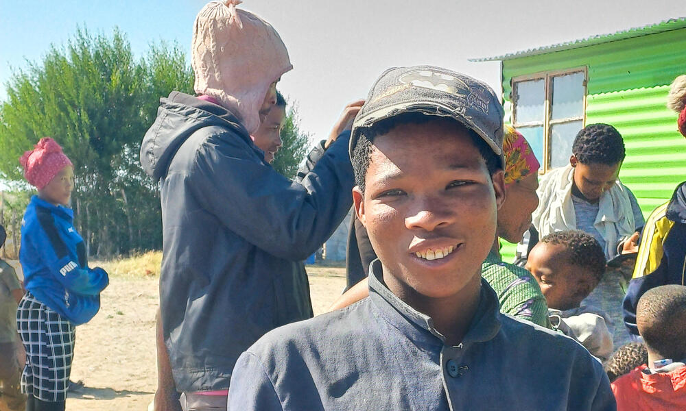 A young village poses for the camera in Nama Pan Village