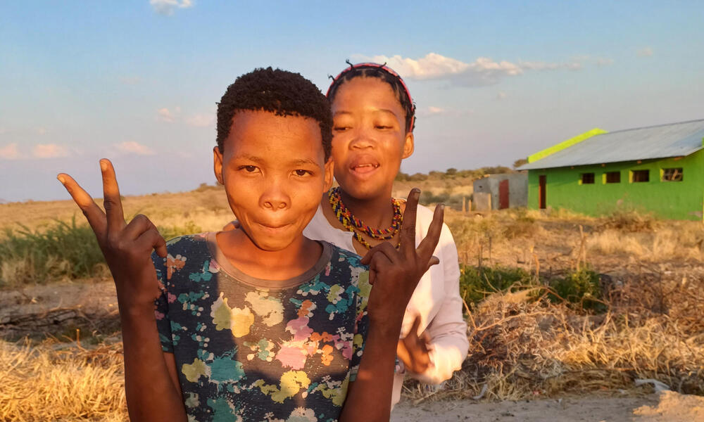two youth playfully pose for the camera in Nama Pan Village
