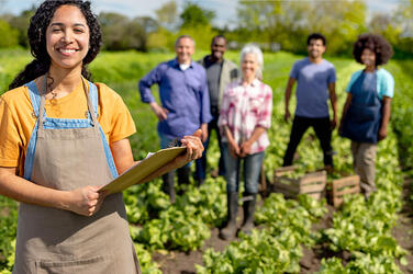 Smiling workers in field