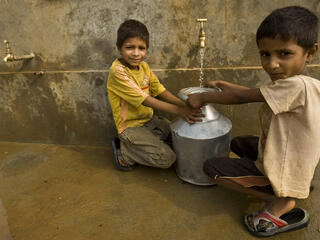 Children collecting spring water