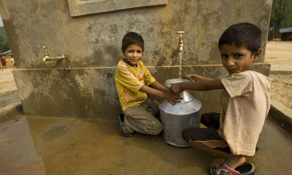Children collecting spring water