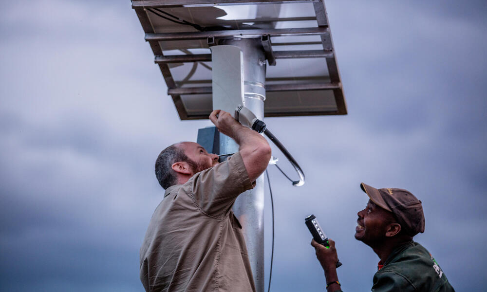 Mike Feldman, electronic security technician for Unilux installing solar panels for FLIR camera system in a National Park in central Kenya.