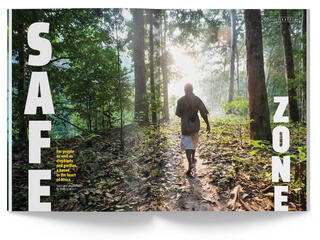 Magazine spread with man walking in forest