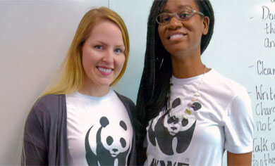 Two Panda Ambassadors posing in WWF t-shirts