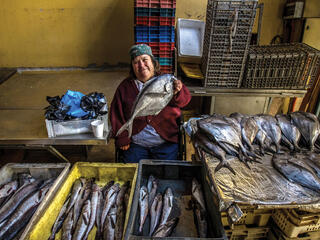 Chilean fisherwoman with fish 