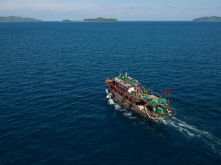 A fishing ship crossing deep blue water