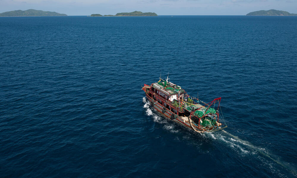 A fishing ship crossing deep blue water