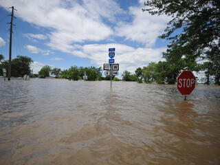 Road signs over floodwaters