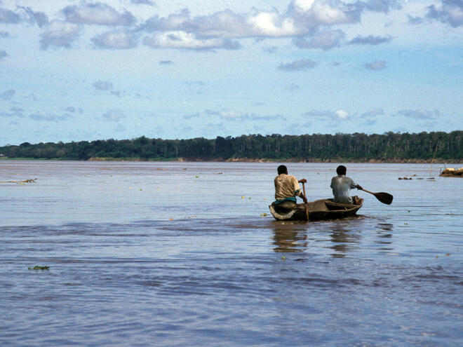people in dugout canoe, Amazon, Peru