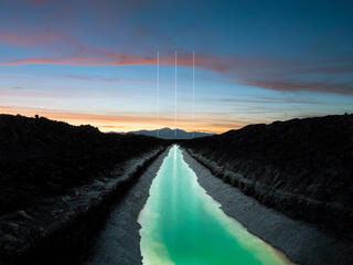 Sunset landscape of canal with 3 vertical lines