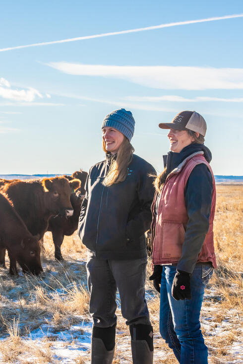 Laura Nowlin and friend outside with cattle
