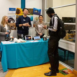 A student talks to members of the wildlife team at the HBCU Career fair