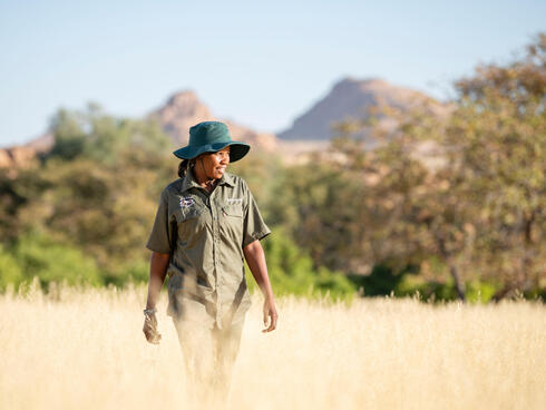 Rhino ranger Erlyn Touros looks for rhino tracks in the Uibasen Twyfelfontein Conservancy, Namibia