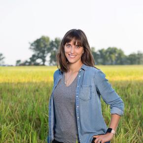 Hallie Shoffner stands in a field