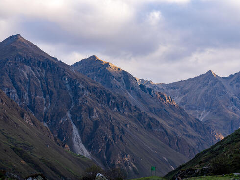 Tall peaks of the Himalayan Mountains in Bhutan on a cloudy day