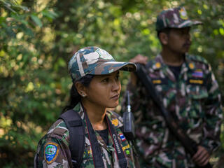 Woraya Makai (34) walks through the jungle during of a morning patrol together with a team of rangers. She’s the only female ranger deployed in Kui Buri and in charge of photographing and surveying the animals she’s seeing around the park.