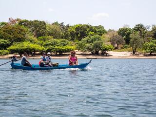 Visitors on a canoe trip led by Kumaruara leader