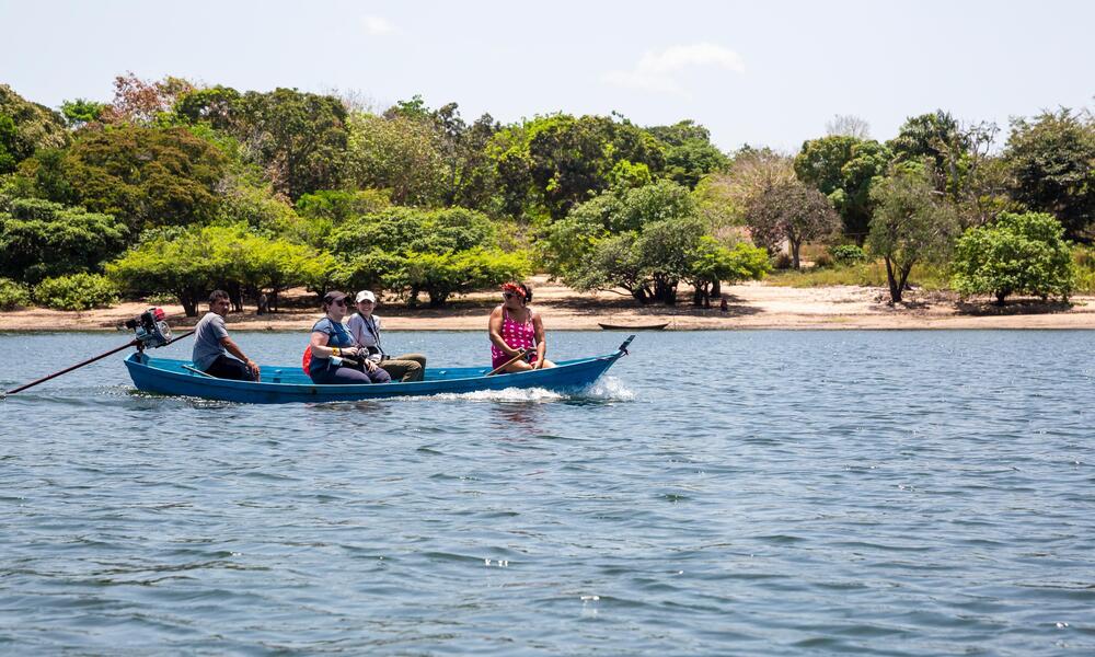 Visitors on a canoe trip led by Kumaruara leader
