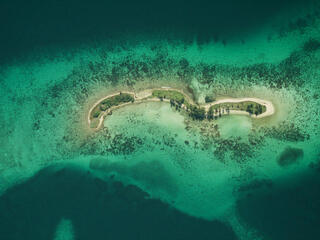  Laughing Bird Caye National Park Aerial view of coral reef from 6,000 ft