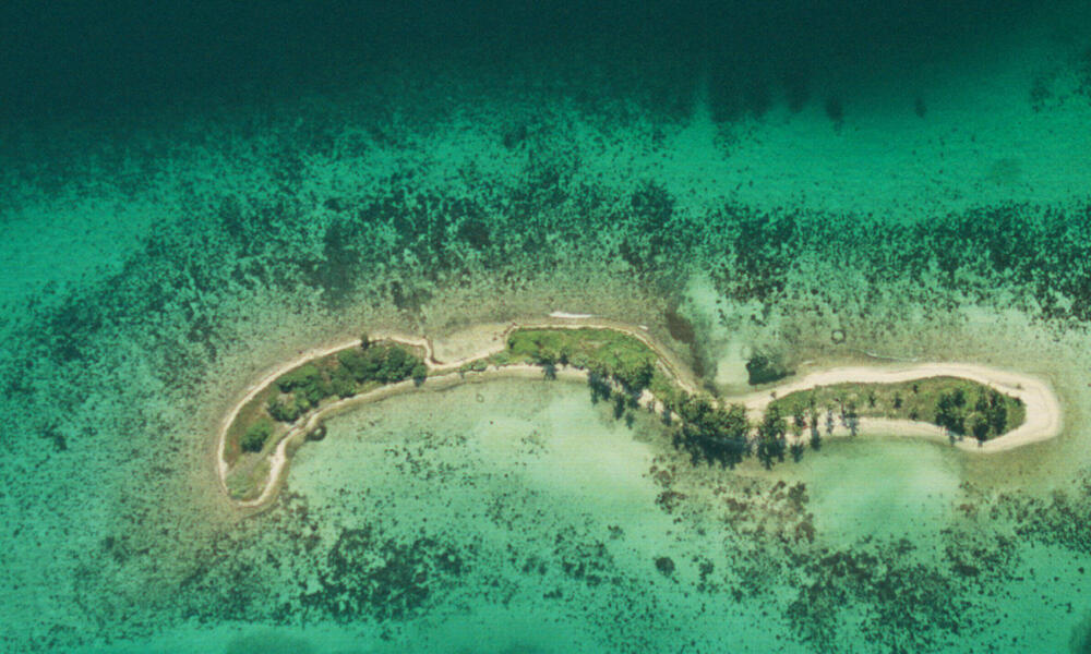 Aerial view of the coral reefs around Laughing Bird Caye National Park, Belize.
