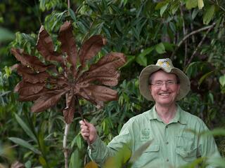 photo of thomas lovejoy with cecropia leaf taken in july 2014