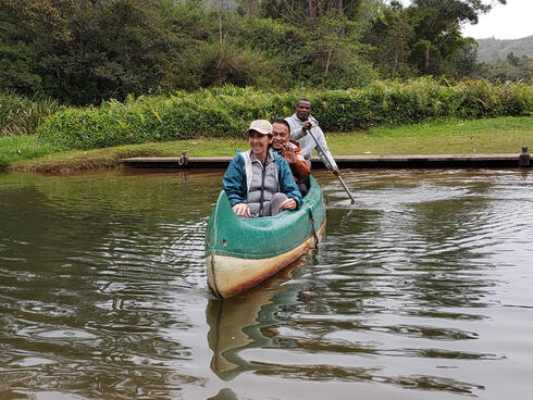 Smiling people in a canoe
