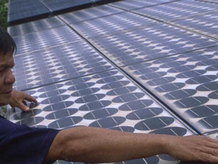 Man checking solar cells