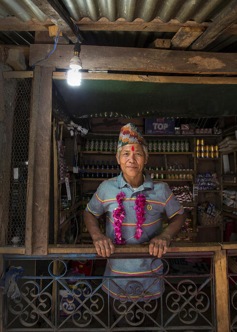 Sunbir Ghale's house powered by electricity from a "micro-hydro" system