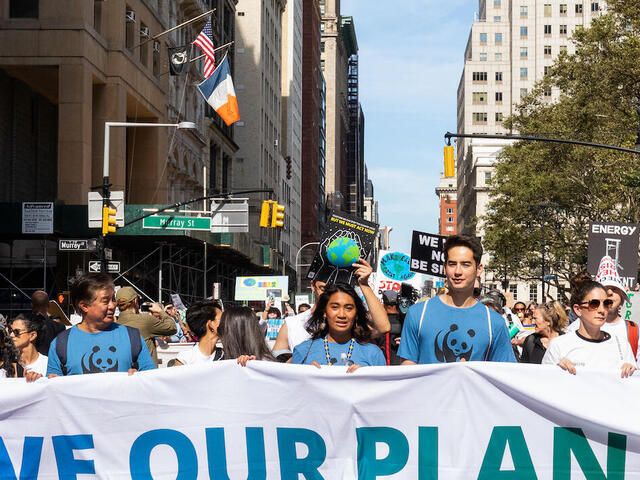 WWF supporters and activists marching down a New York City street during the 2019 People's Climate March