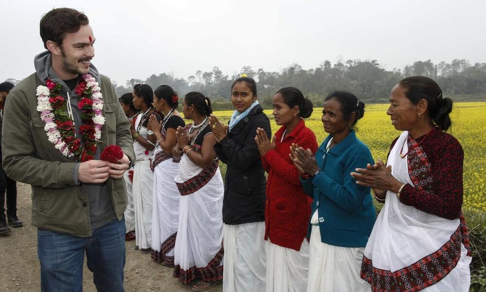Nicholas Hoult is greeted by the Amaltari community