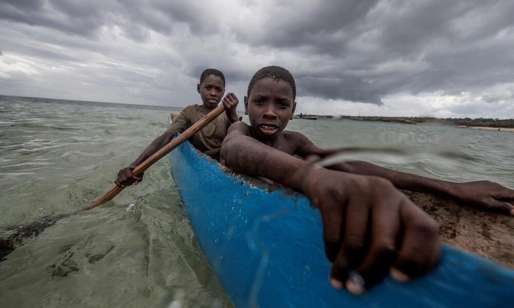 Boys fishing in Nuarro cove