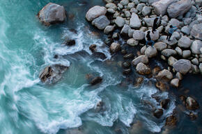Aerial photo of riverside with rocks