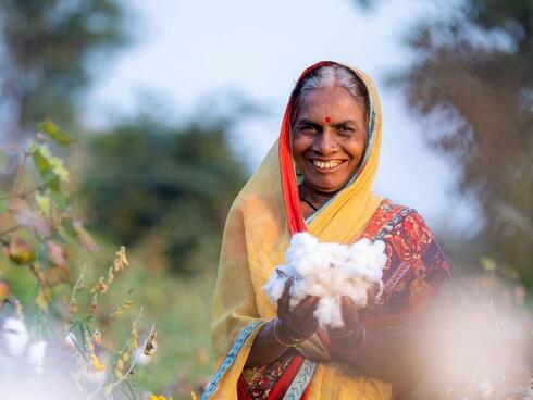 Organic cotton farmer holding their harvested crops