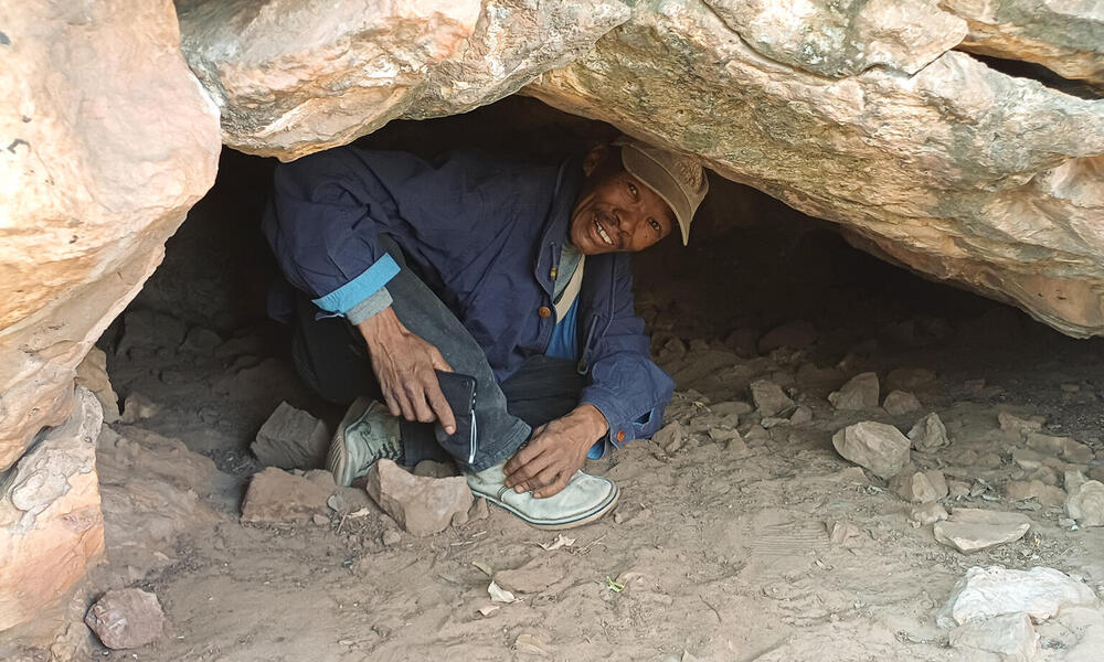Smiling man in a cave
