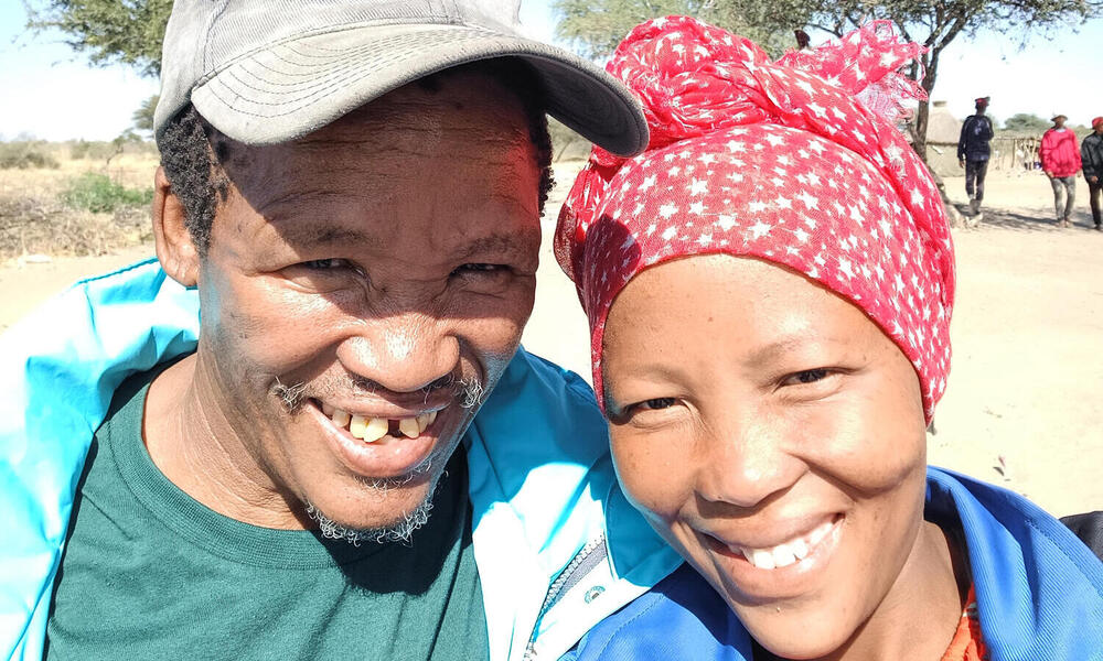 Two people smiling at camera